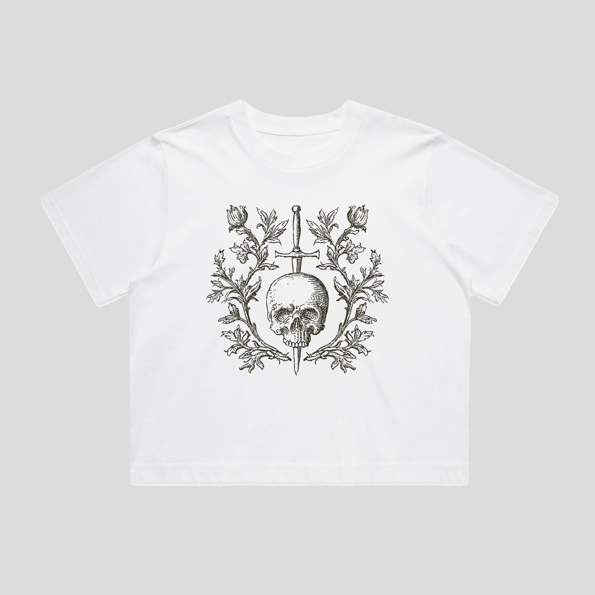 White t-shirt with a black skull and floral design on a light gray background
