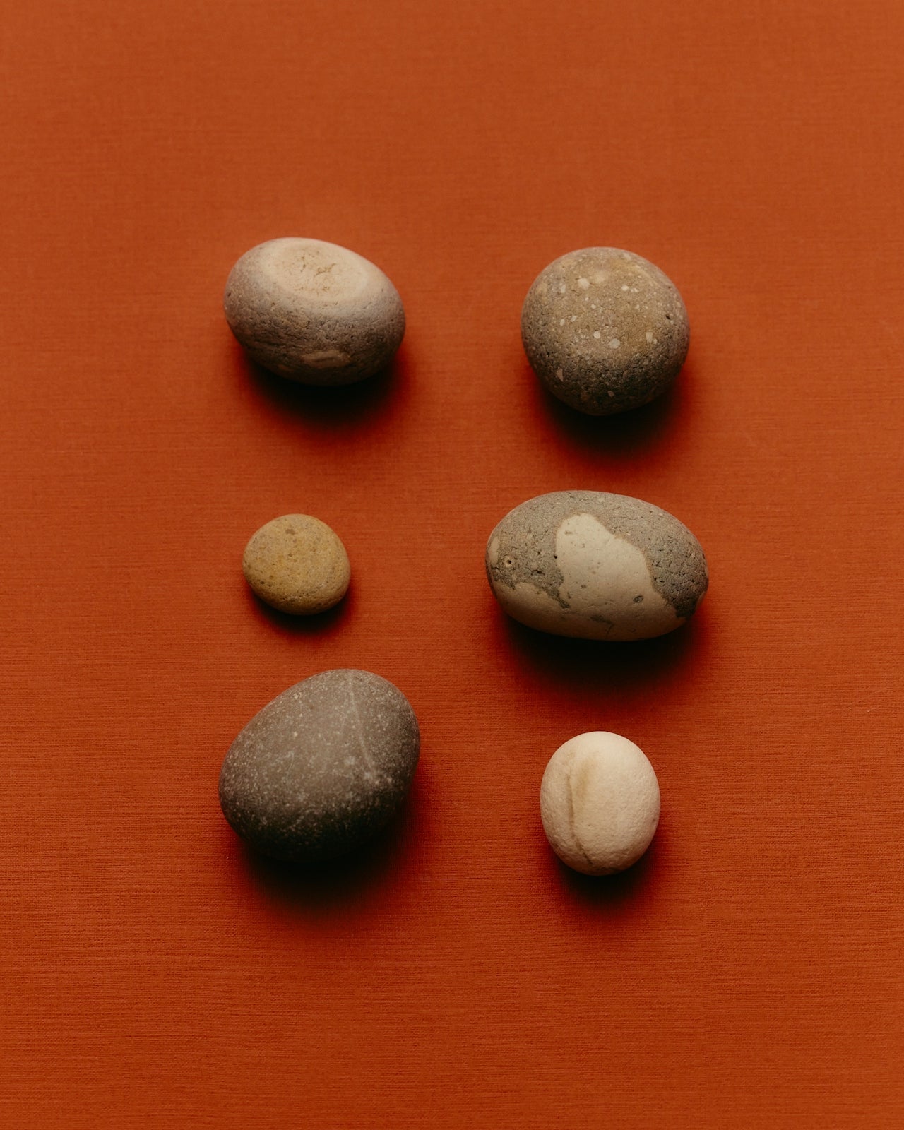 Rocks arranged on an orange background